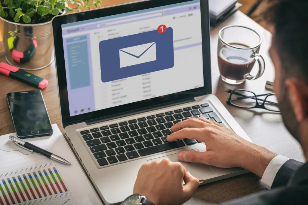 a man on his laptop checking his email - email marketing - digitech