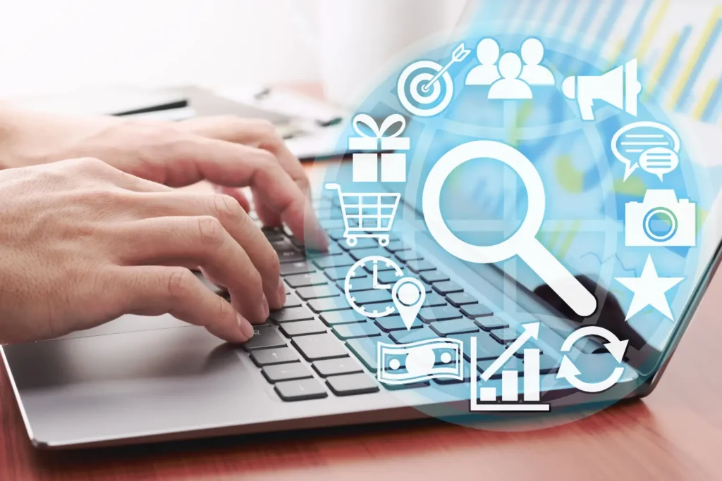 hands on a keyboard while icons showing content strategies float in a circle - digitech